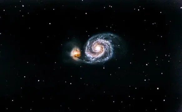 The Whirlpool Galaxy, Messier 51, interacting with a smaller companion galaxy